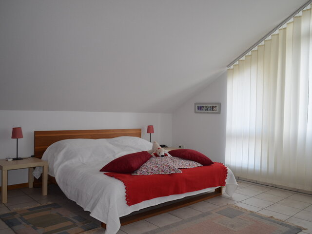 Schlafzimmer 2 im 1. OG/DG
